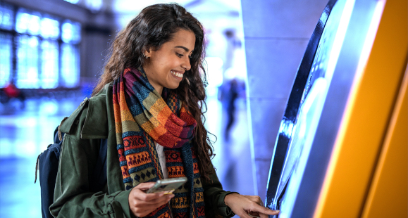 woman using an ATM machine